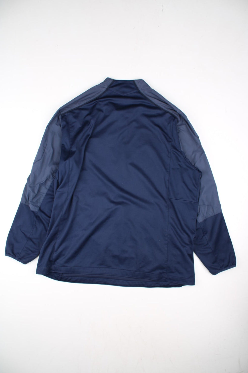 Nike New England Patriots NFL Track Top in a blue colourway.1/4 zip with large club logo on the chest.