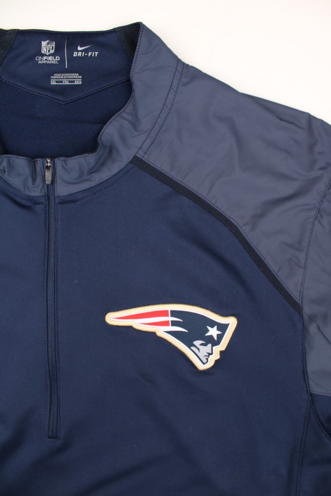 Nike New England Patriots NFL Track Top in a blue colourway.1/4 zip with large club logo on the chest.