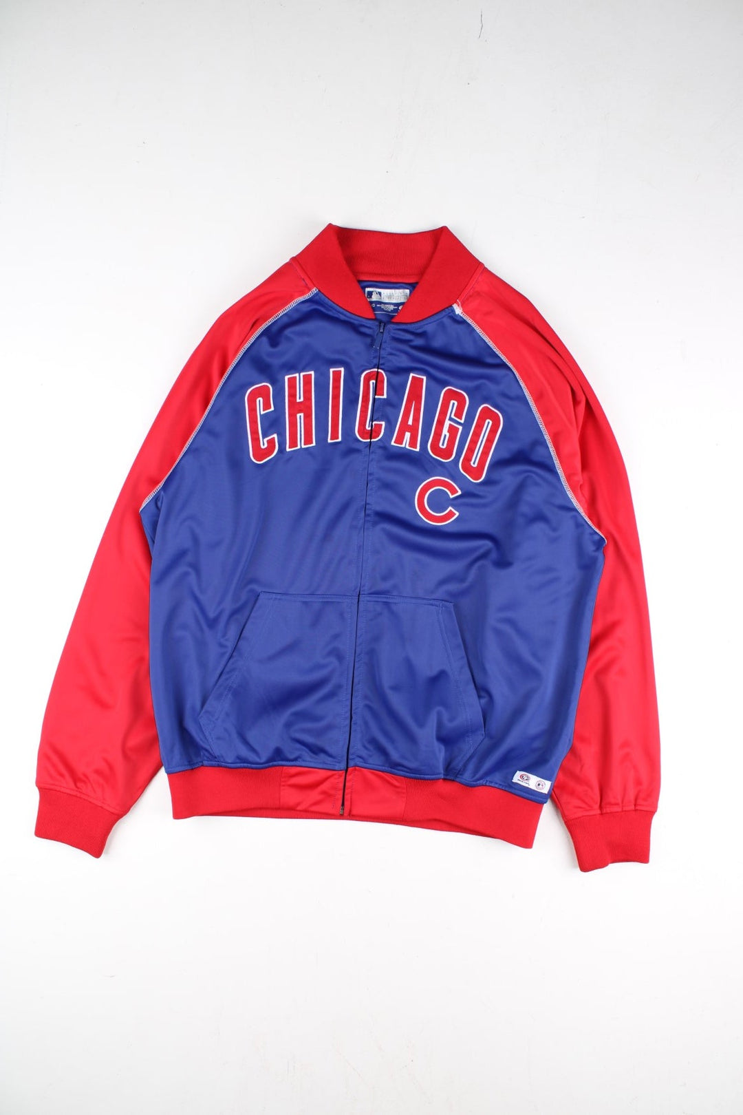 Vintage Chicago Cubs MLB Track Top in a blue colourway with red panelling. Full zip and chicago lettering across the front with small cubs logo. 