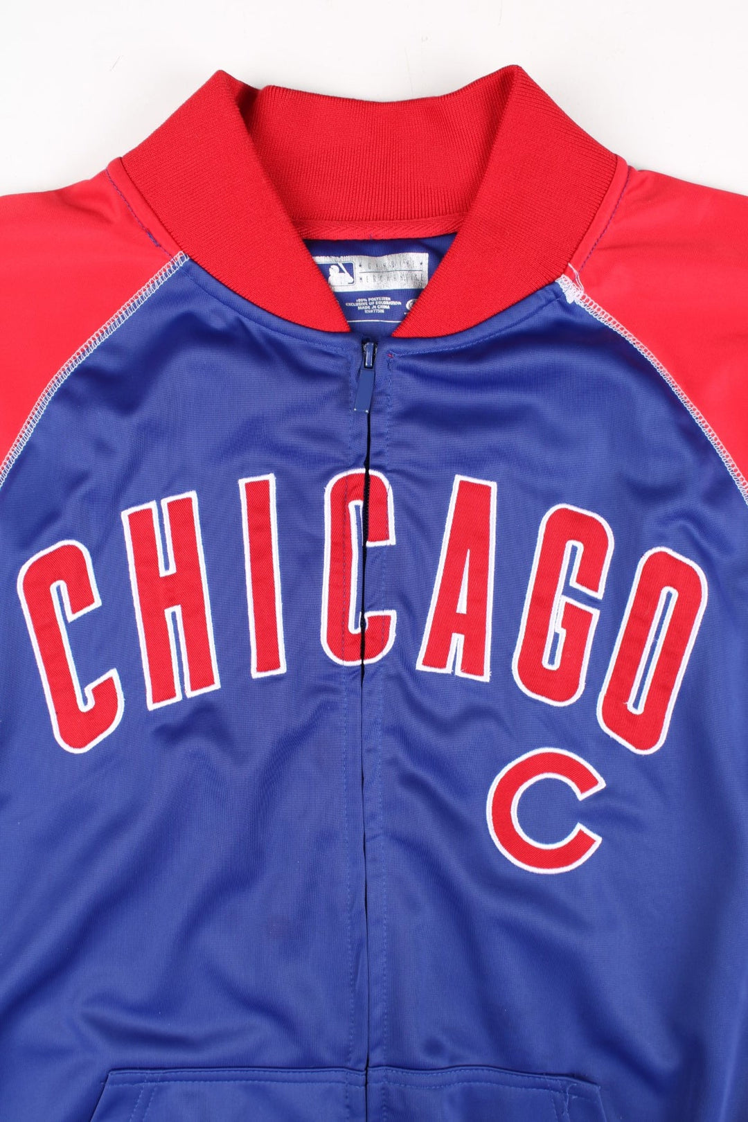 Vintage Chicago Cubs MLB Track Top in a blue colourway with red panelling. Full zip and chicago lettering across the front with small cubs logo. 