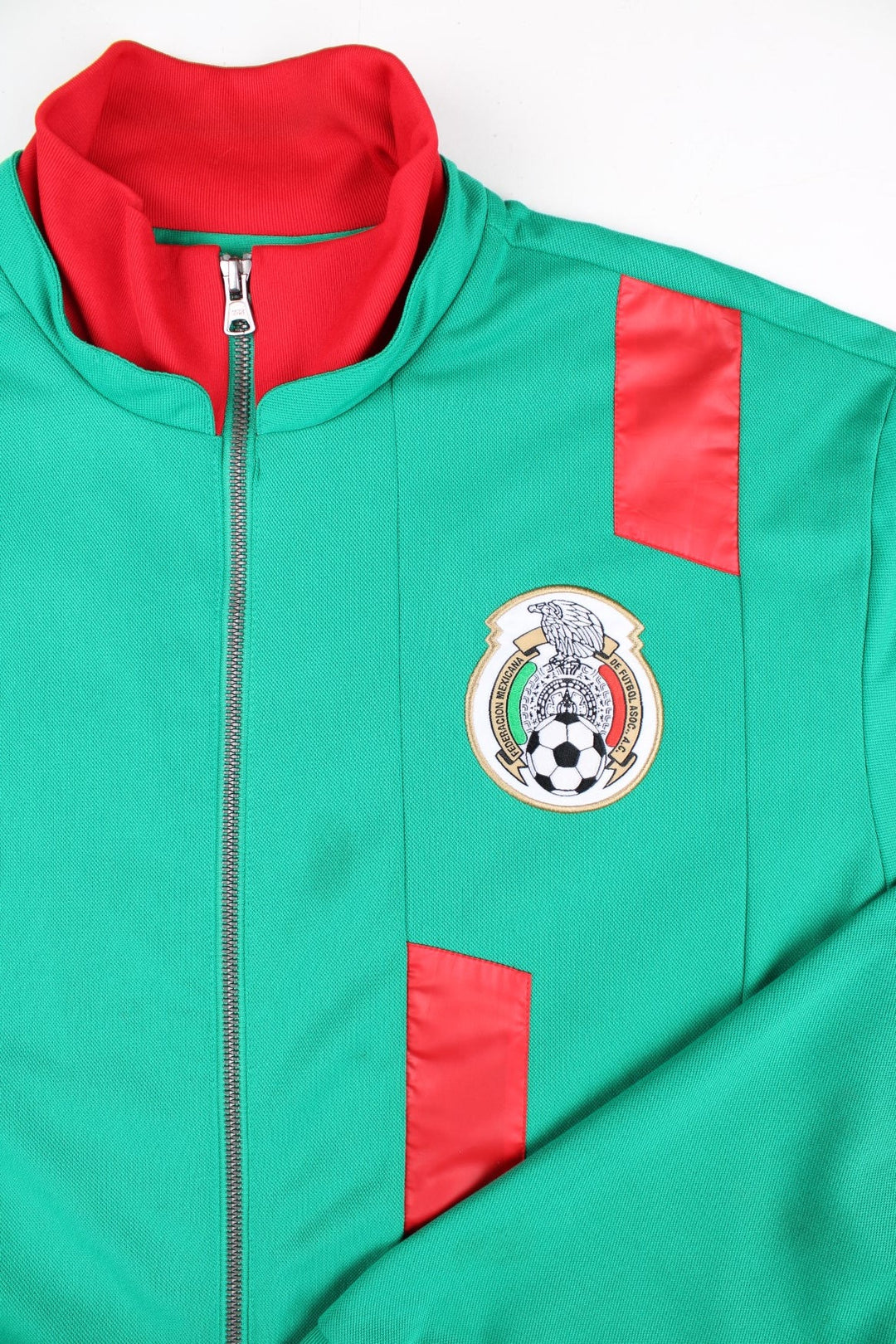 Adidas Mexico Track Top in a green colourway with red stripe and collar. Adidas classic 3 stripe in white down the back and small club logo on the front. 