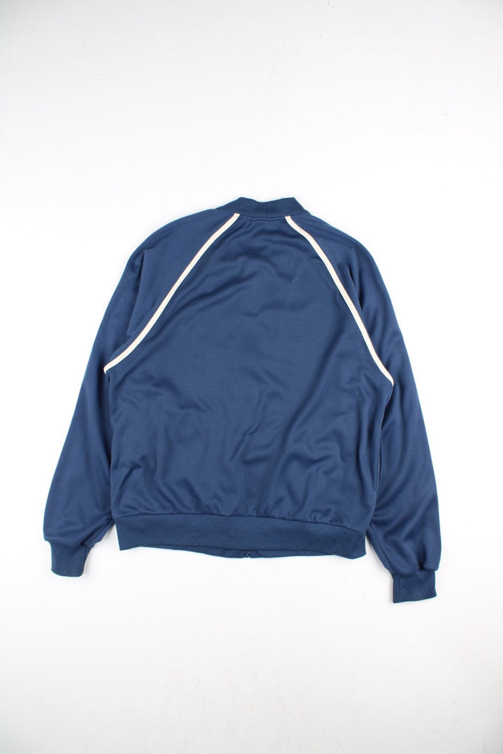 90's Puma Track Top in a blue colourway with yellow logo across the chest. White stripe along the sleeves and front with a full zip.