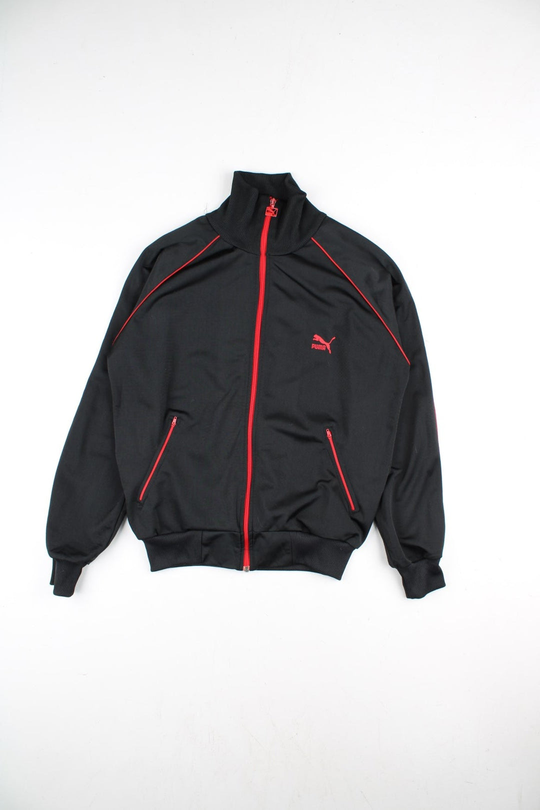 Puma Track Top in a black colourway with a red full zip and stripe. Small Puma logo on the chest