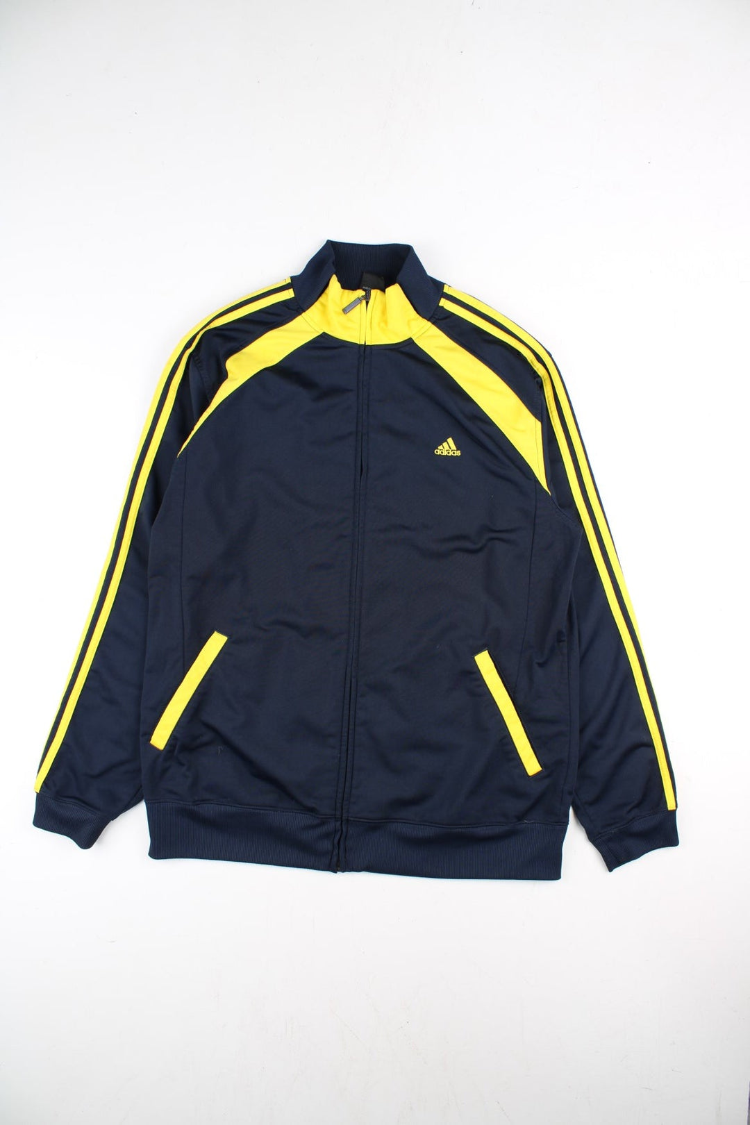 Adidas Track Top in a blue colourway with yellow 3 striple and panelling. Full zip and pockets on the front with NILES lettering on the back.