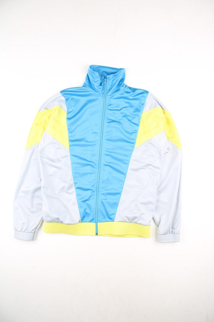 Le Coq Sportif Track Top in a grey colourway with blue and yellow panelling.Full zip with two side pockets. Buttons up and has side pockets.