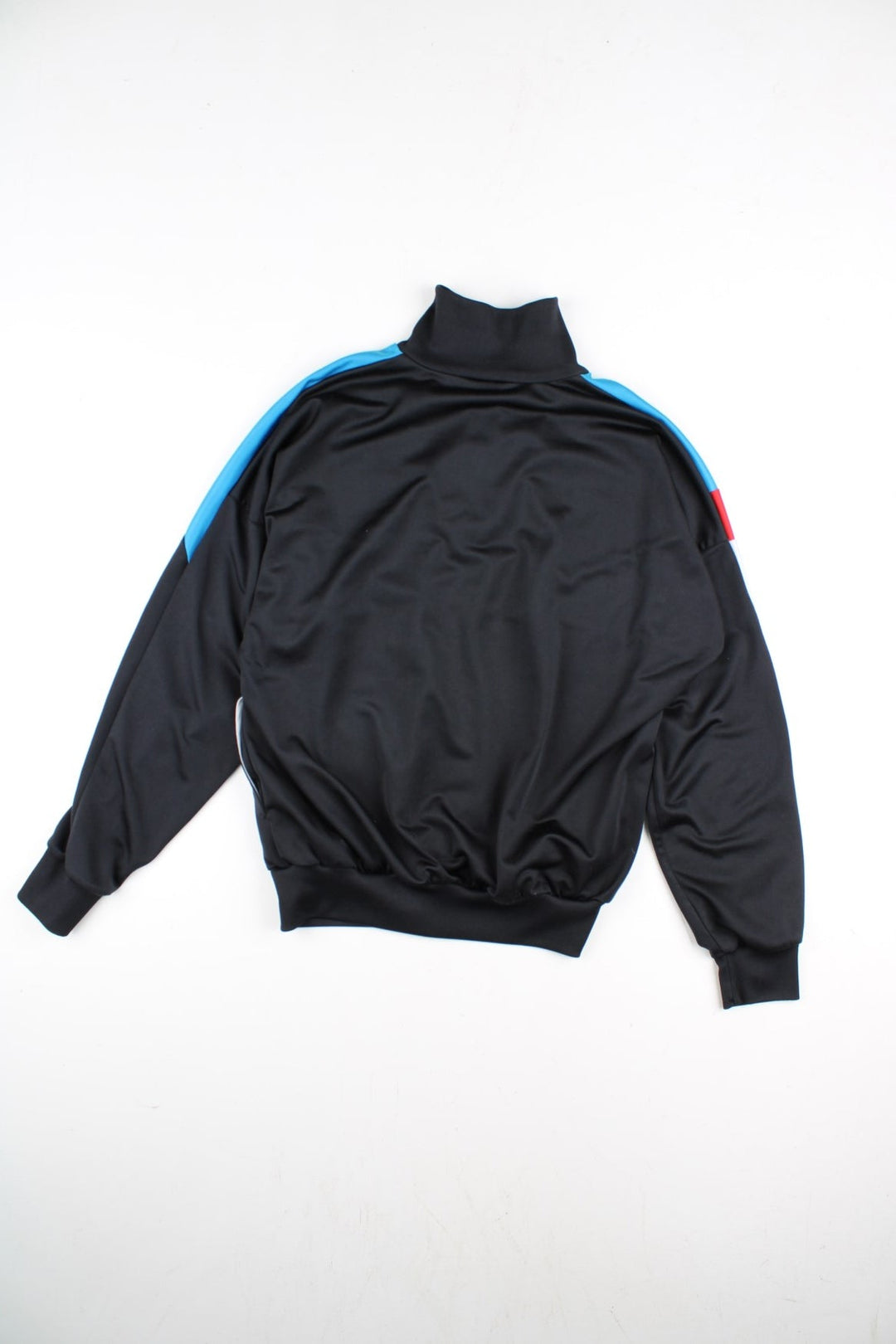 Vintage Adidas Track Top in a black colourway with blue top half panelling and small classic logo on the front with a full zip