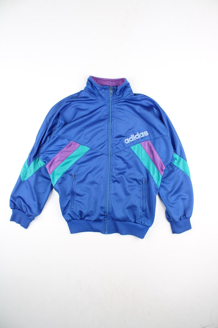 Vintage Adidas Track Top in a blue colourway with small green and purple stripes on front and the sleeve. Full zip with two zip pockets and small classic logo on the front.