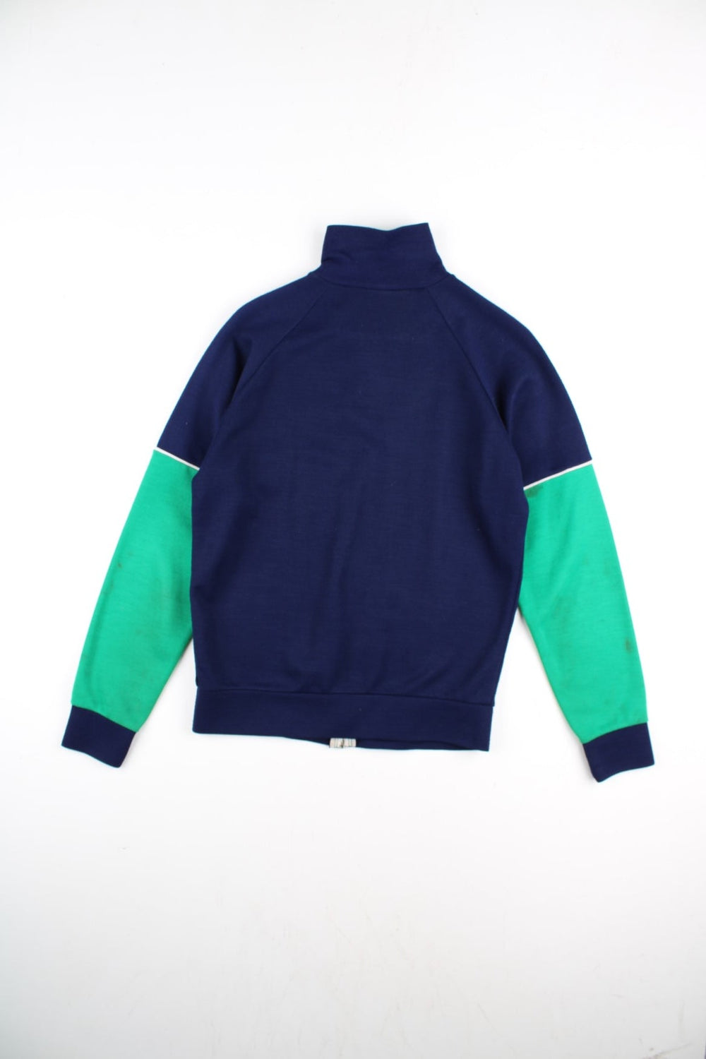 Vintage Fred Perry Track Top in a blue colourway with green panelling. Full zip design and small embroidered logo on the front.