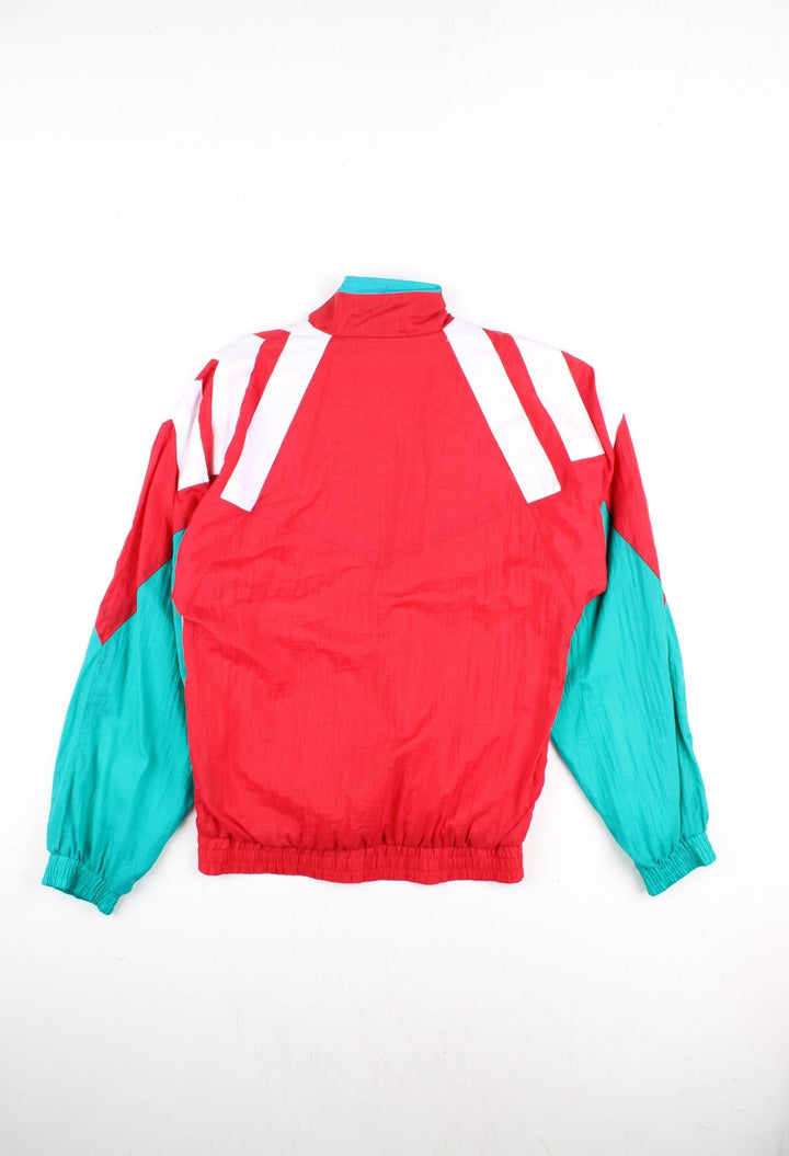 Vintage Adidas 92-93 Liverpool Track Top in a red colourway with green and white stripe panelling. Full zip with zip pockets and vintage Liverpool badge n the chest.