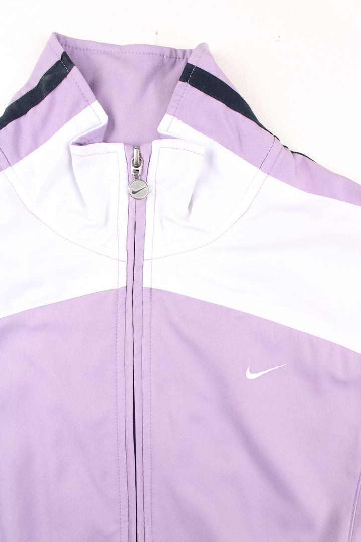 Vintage Nike Y2K Track Top in a purple colourway with white and black stripe panelling. Full zip with two side pockets and small Nike swoosh on the front