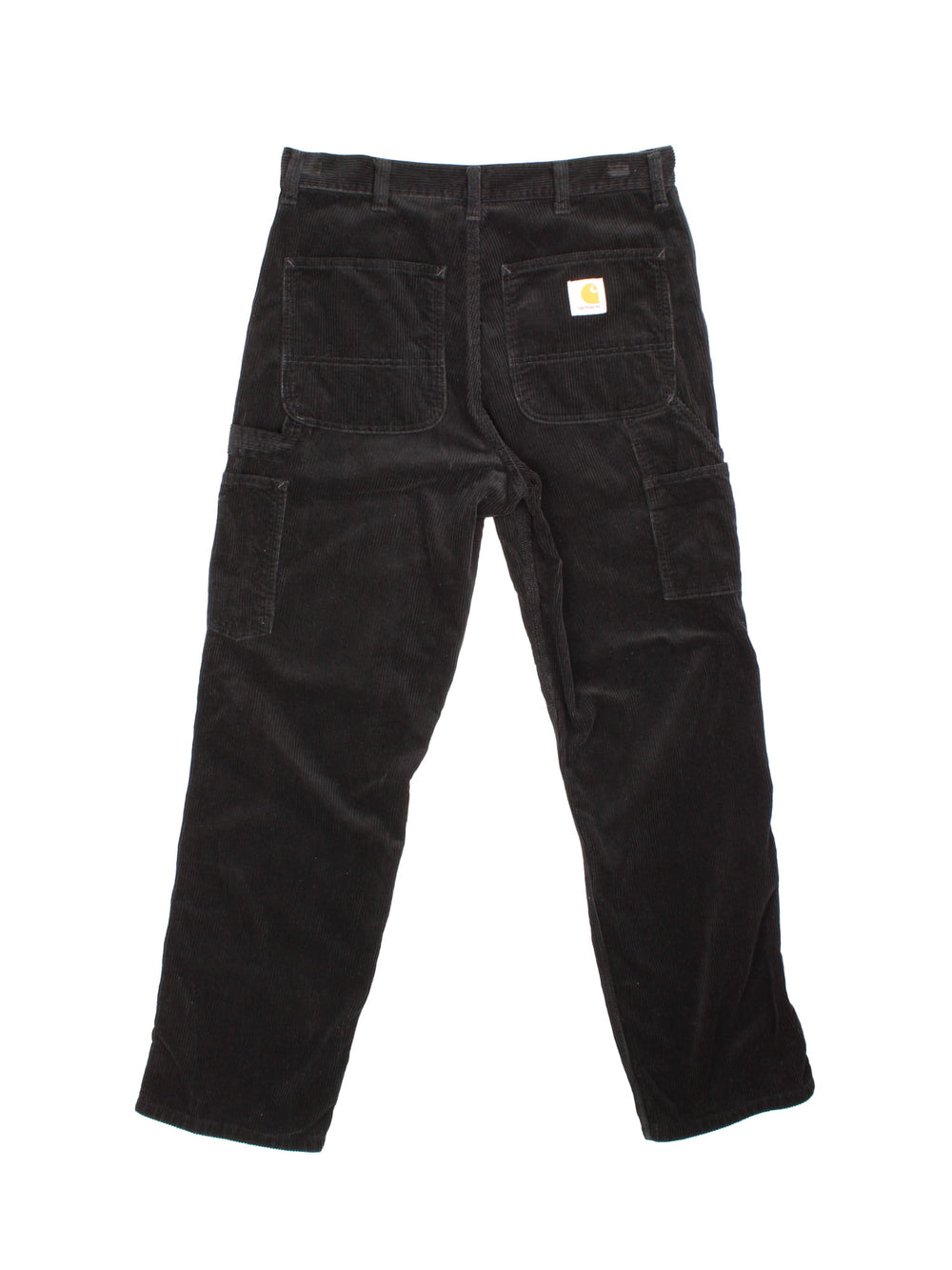 Carhartt corduroy trousers in black with multiple pockets, a hammer loop, zip and button closure, and a logo patch on the back pocket.