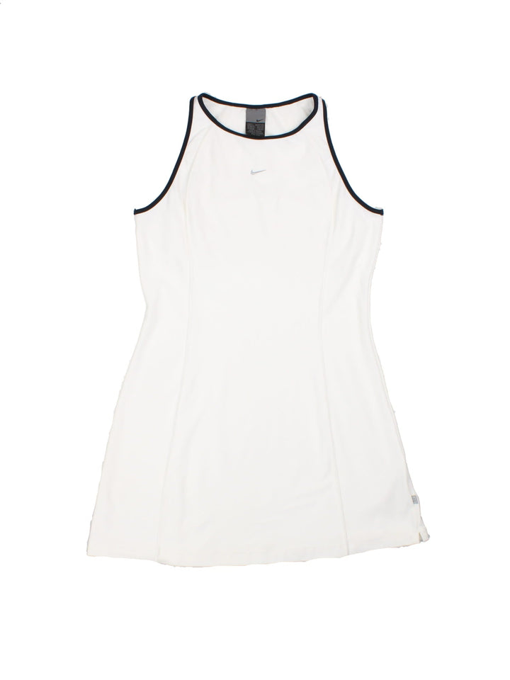 Nike A-line tennis dress in white with black piping and a small embroidered swoosh on the chest.