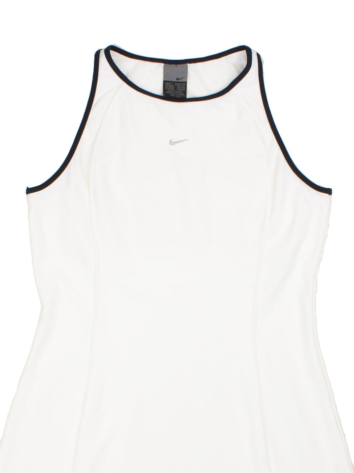 Nike A-line tennis dress in white with black piping and a small embroidered swoosh on the chest.