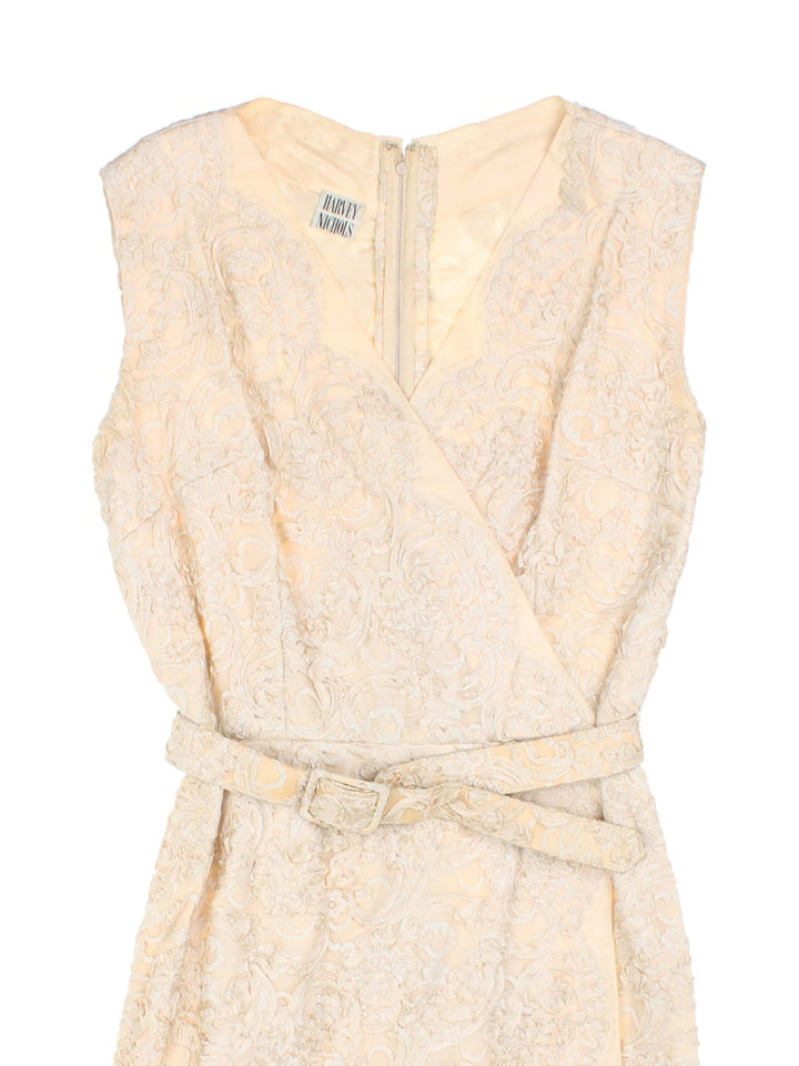 60s Harvey Nichols dress and jacket set in cream lace. Dress has zip closure in the back and a matching belt. Jacket has hook and eye closure and a Peter Pan collar.