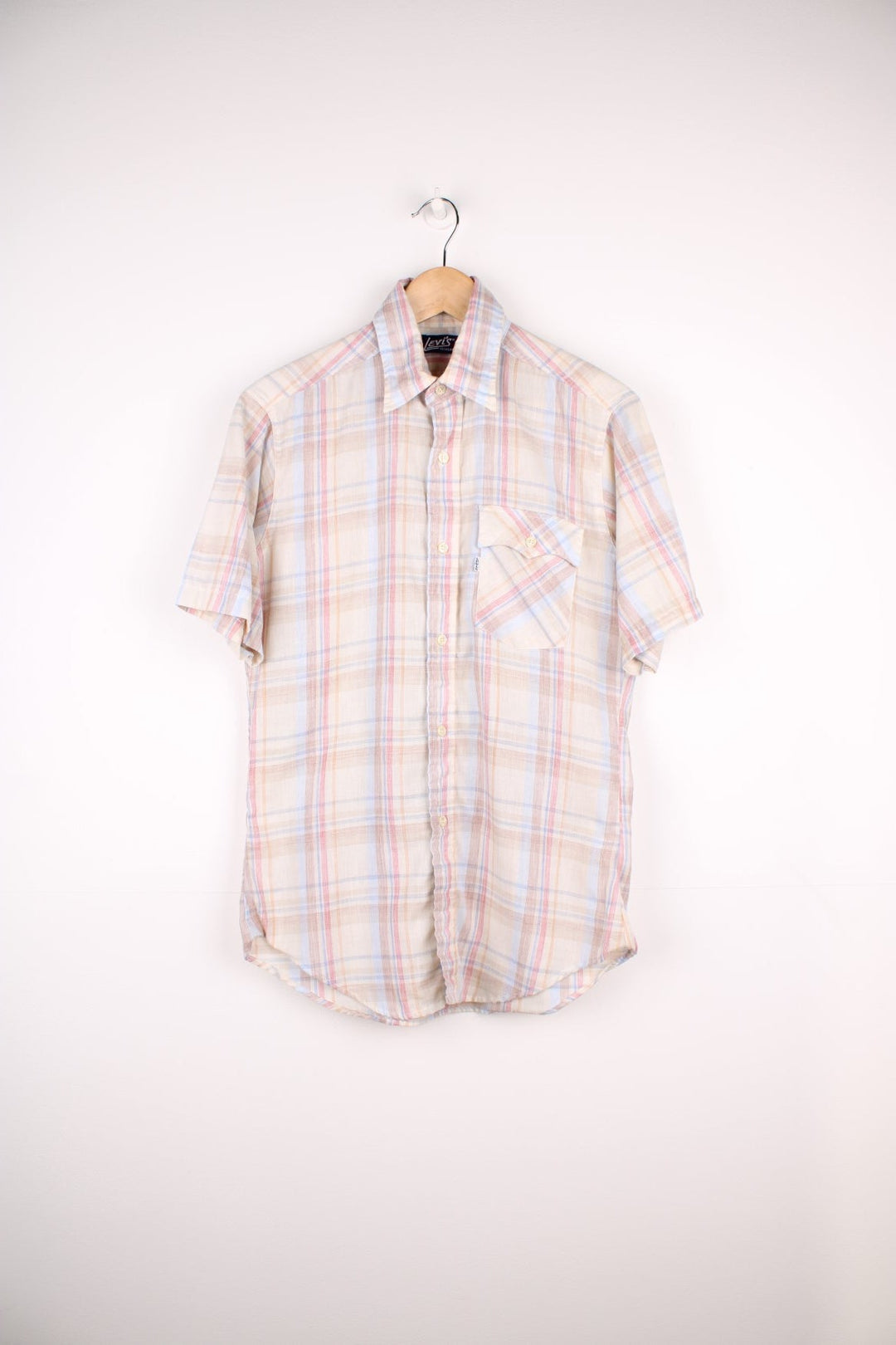 Levi's tan check short-sleeved shirt with one flap pocket and button closure. 