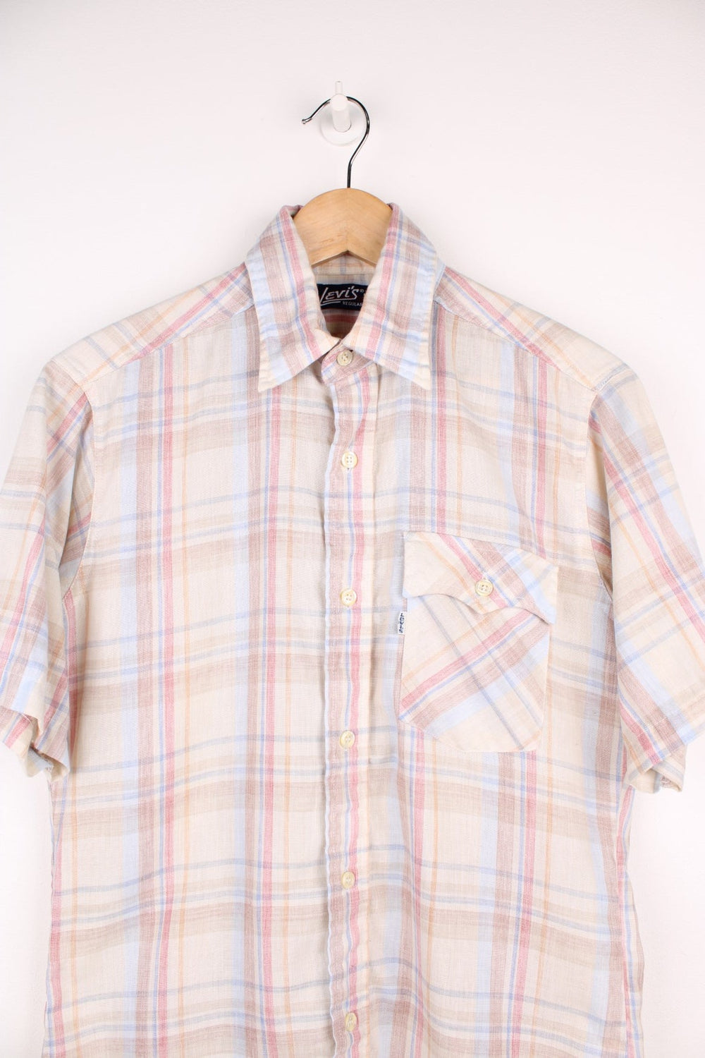 Levi's tan check short-sleeved shirt with one flap pocket and button closure. 