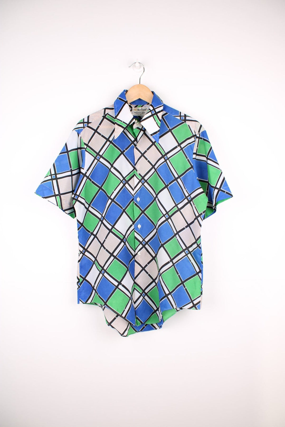 Blue and green geometric patterned short-sleeved shirt by Marlboro, with a dagger collar and buttons. 