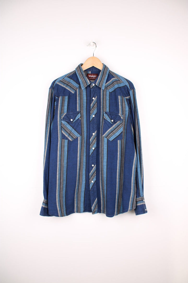 Blue striped Wrangler shirt with two flap pockets. 