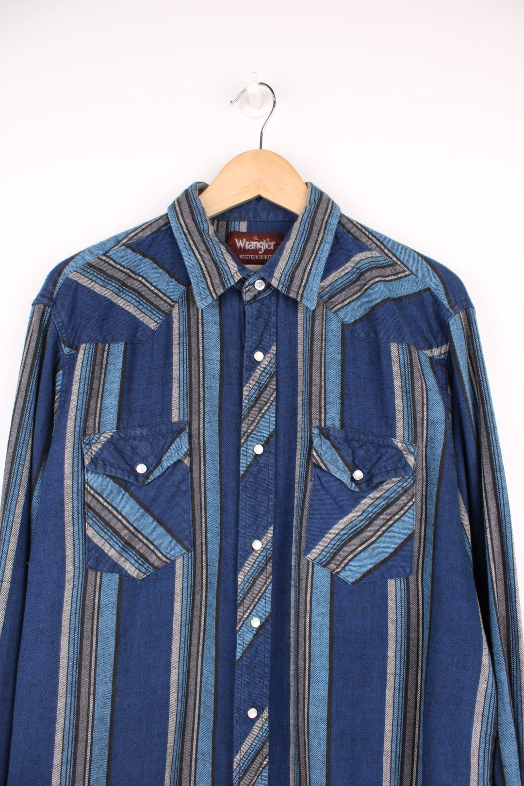 Blue striped Wrangler shirt with two flap pockets. 