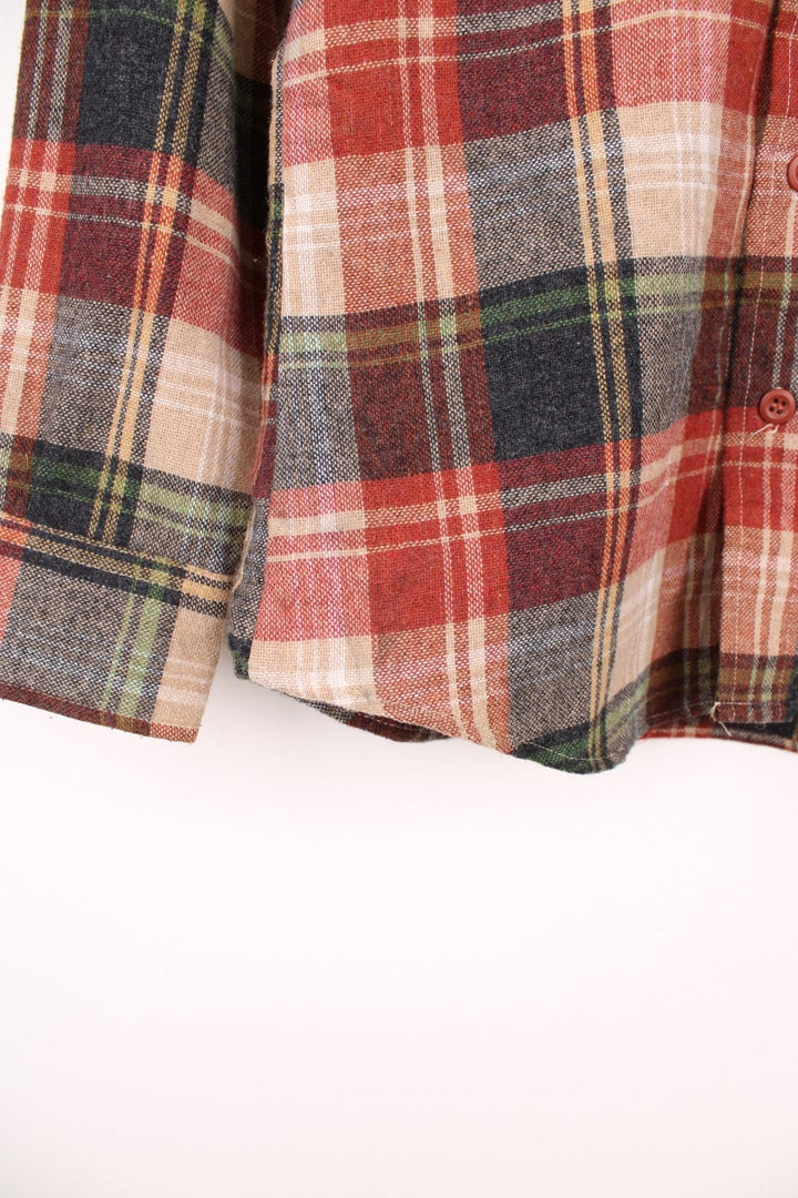 Wrangler red and brown plaid shirt with one flap pocket. 