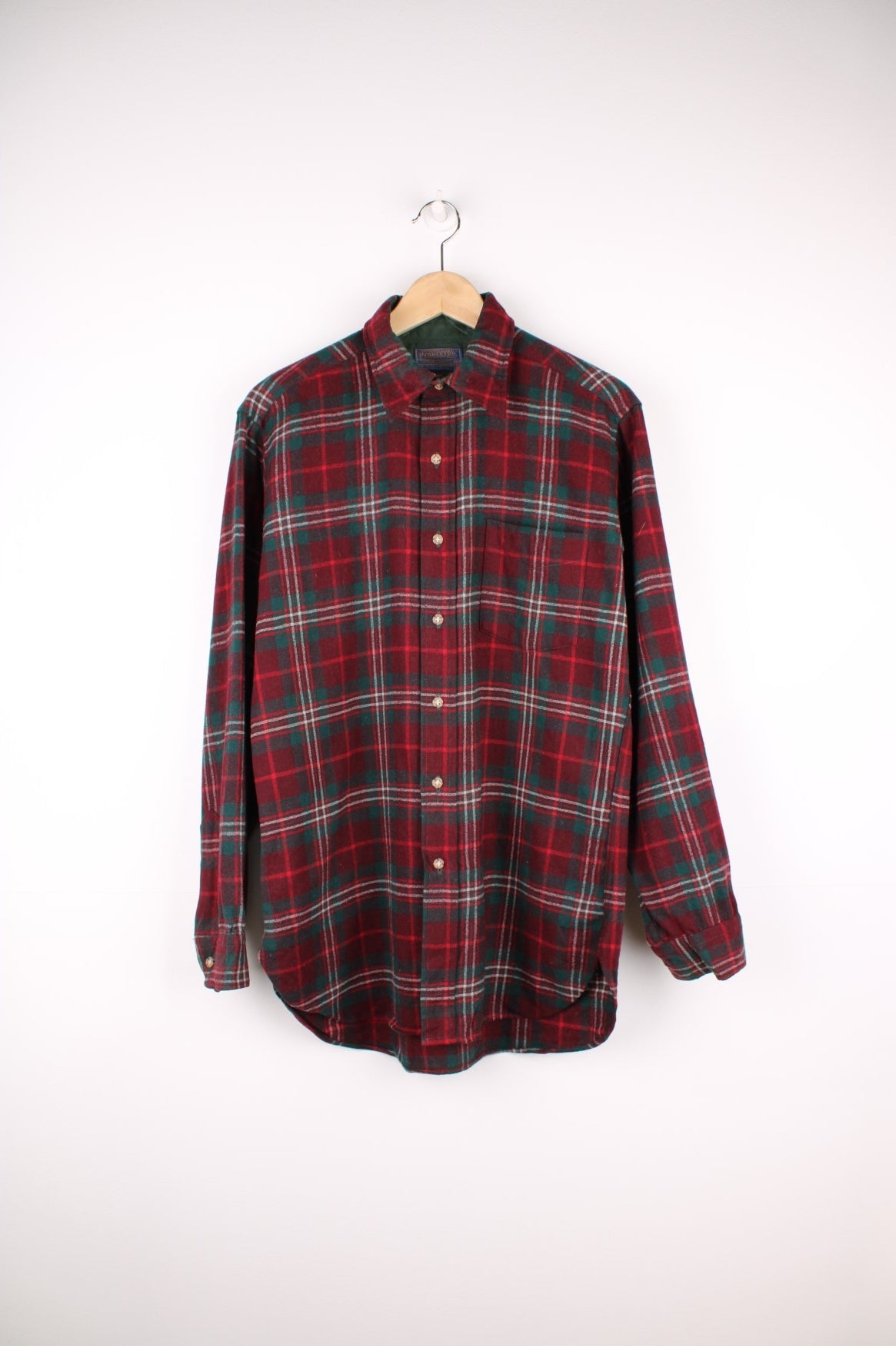 Red and green plaid Pendleton Shirt. 100% wool, with one breast pocket. 