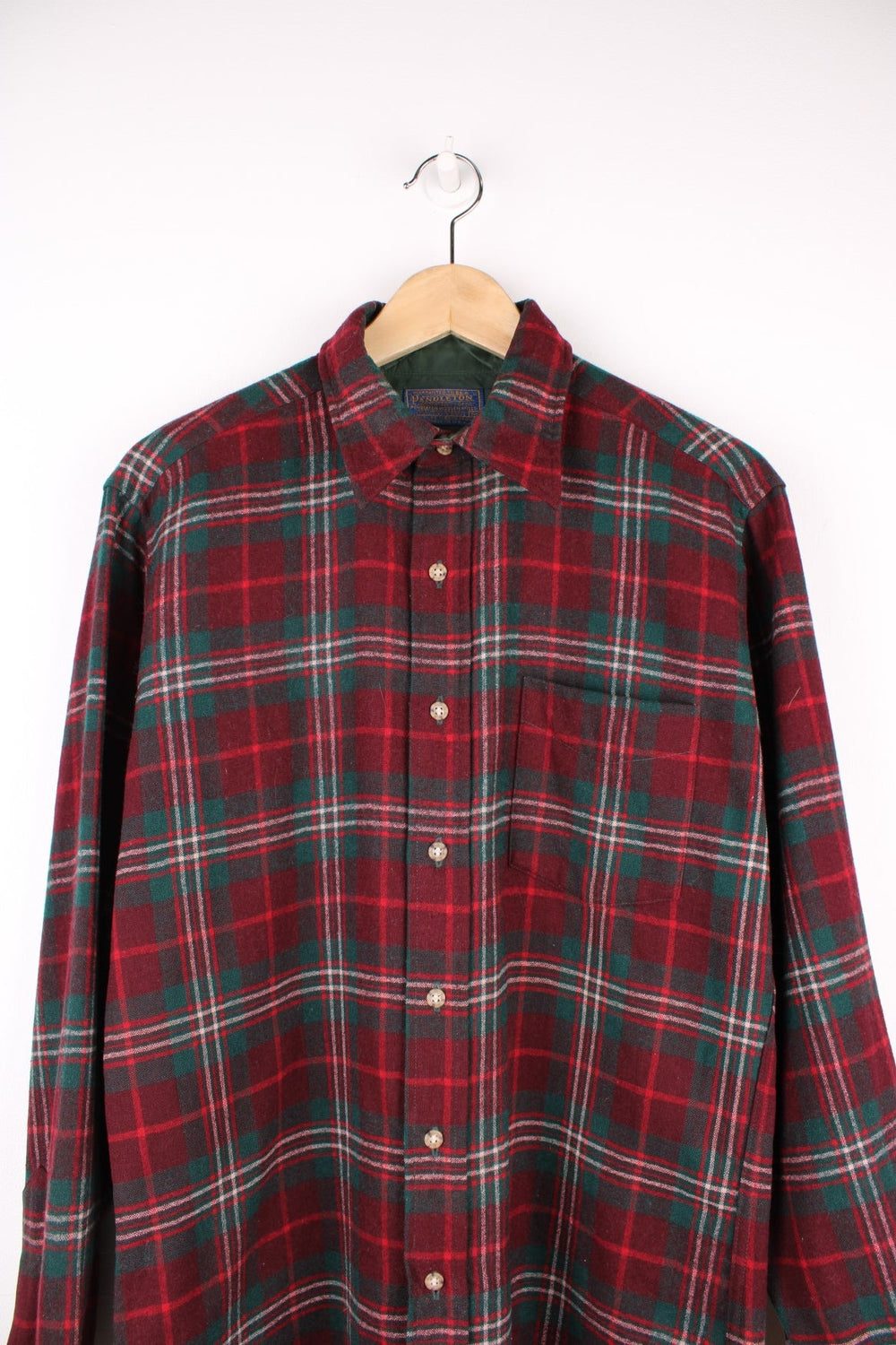 Red and green plaid Pendleton Shirt. 100% wool, with one breast pocket. 