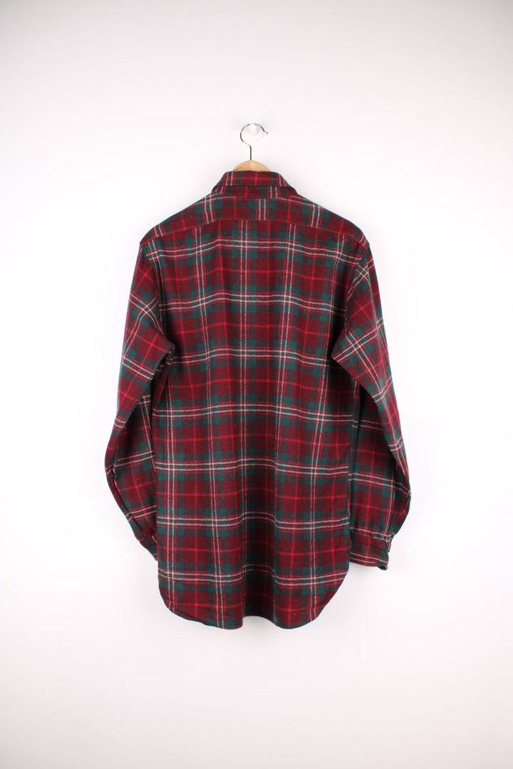 Red and green plaid Pendleton Shirt. 100% wool, with one breast pocket. 