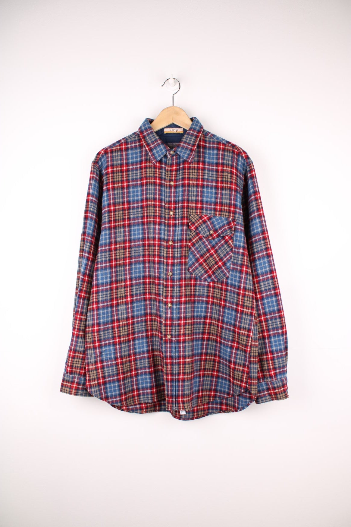 Blue and red plaid Pendleton shirt, 100% wool with one buttoned flap pocket.