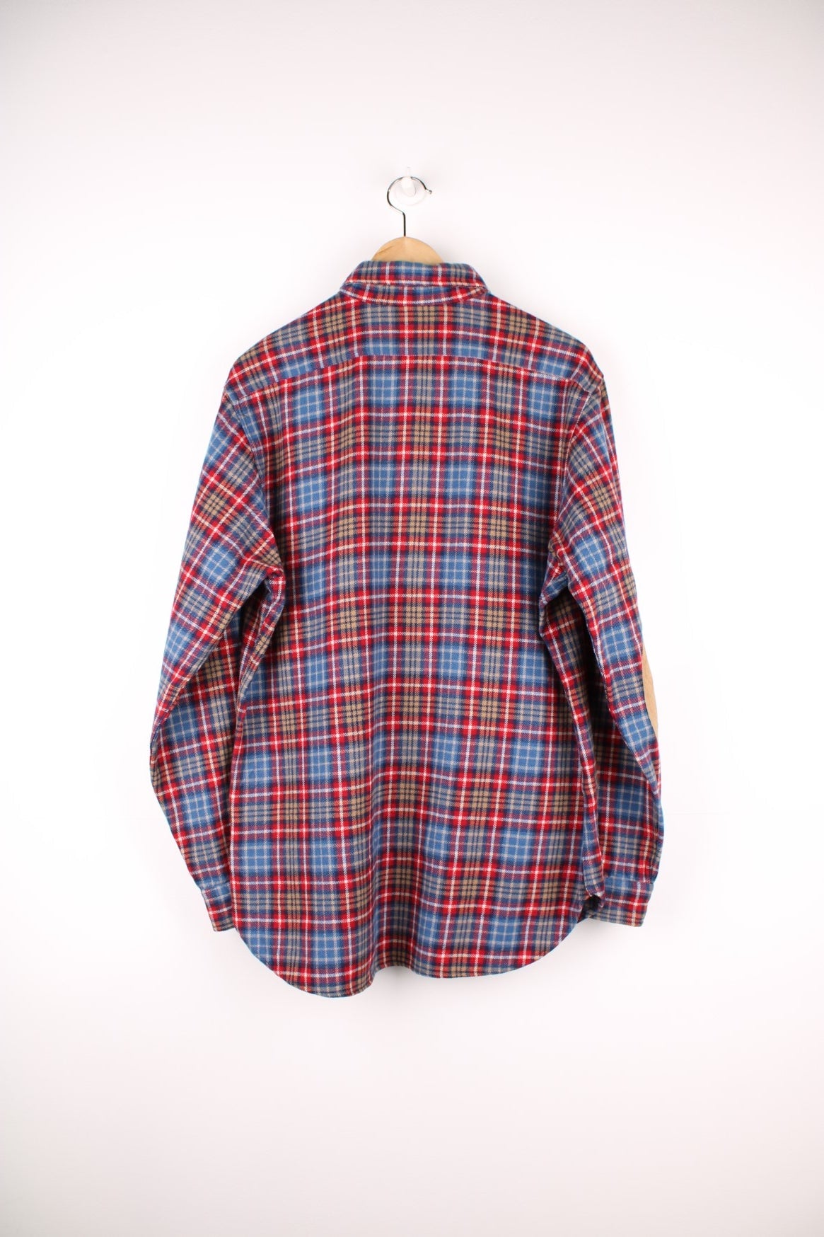 Blue and red plaid Pendleton shirt, 100% wool with one buttoned flap pocket.