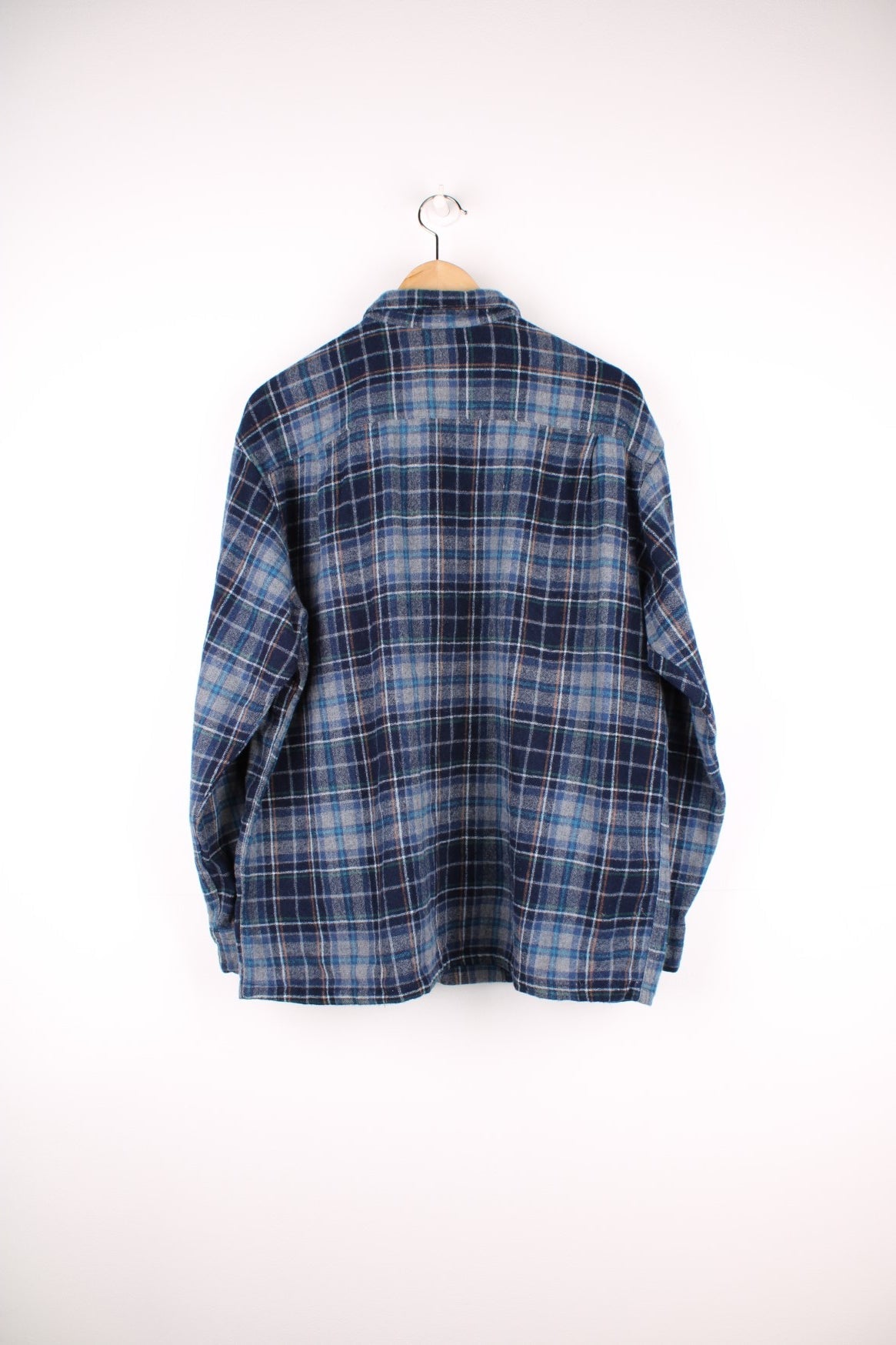 Blue plaid Pendleton shirt, 100% wool with two buttoned flap pockets.