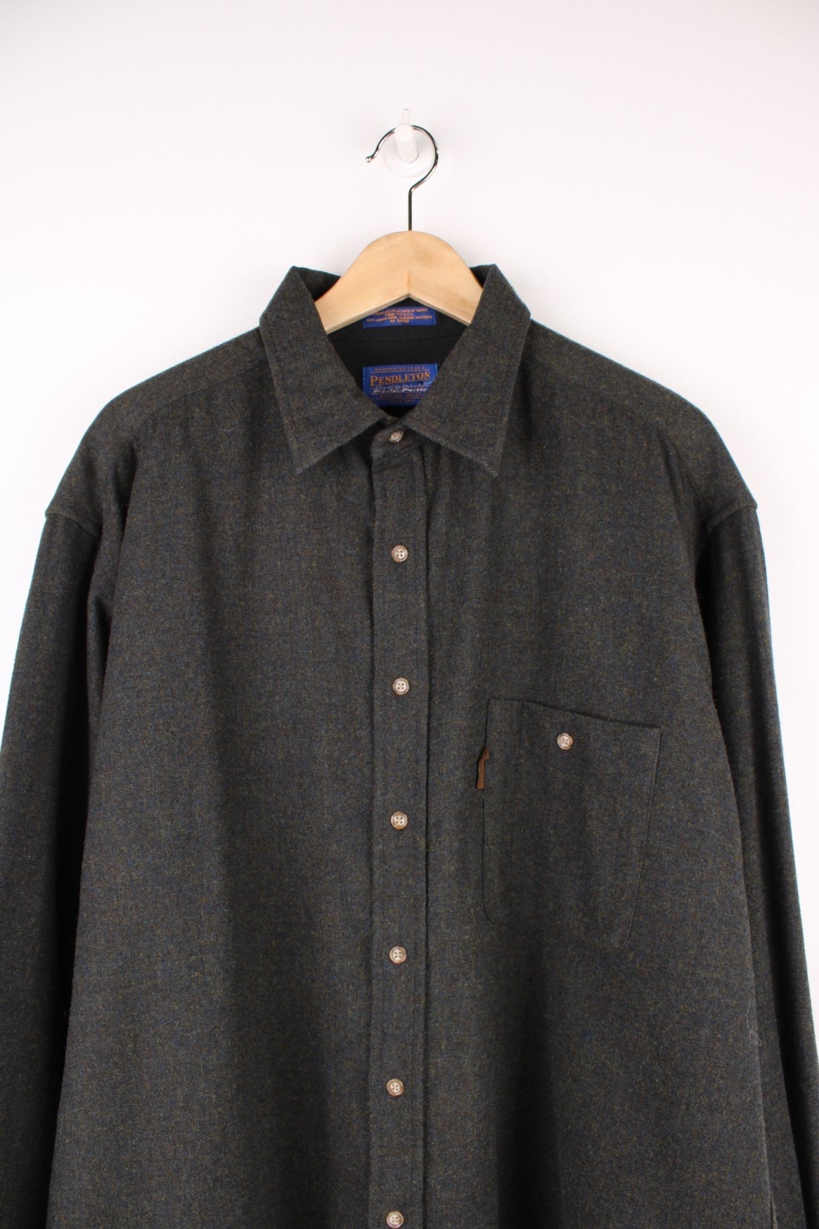 Grey Pendleton shirt, 100% wool with one buttoned flap pocket. 