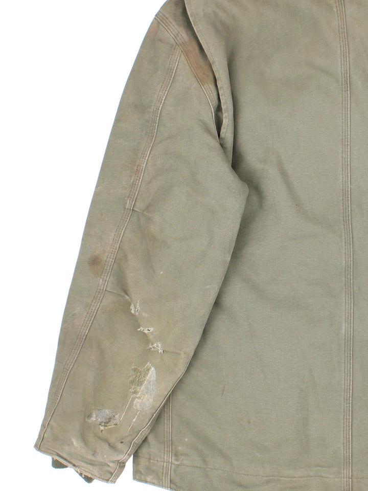 Vintage Carhartt Arctic Jacket in a khaki green colourway with a brown collar. Zips up and has multiple pockets, insulated with a sherpa lining, and has the logo embroidered on the front.