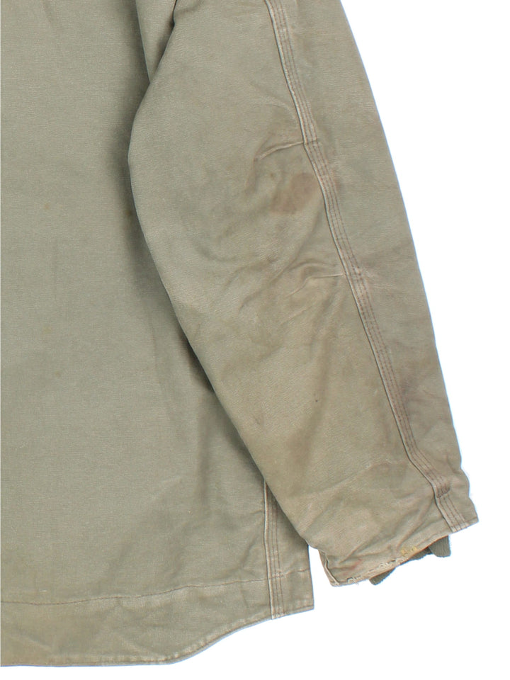 Vintage Carhartt Arctic Jacket in a khaki green colourway with a brown collar. Zips up and has multiple pockets, insulated with a sherpa lining, and has the logo embroidered on the front.