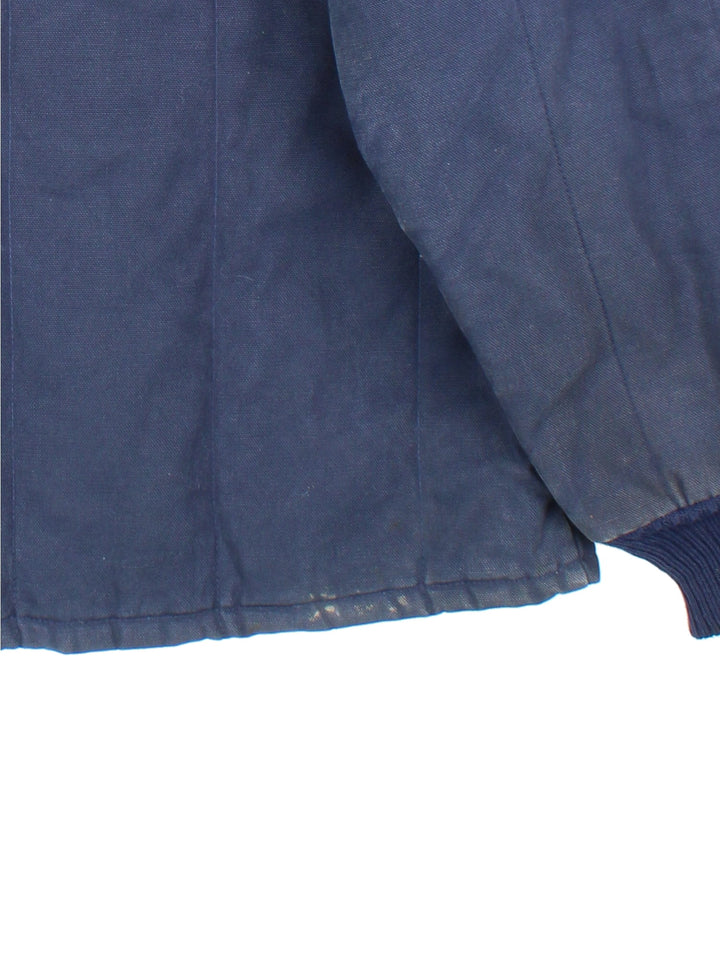 Vintage Walls Blizzard-Pruf Jacket in a navy blue colourway. Zips up and has side pockets, insulated with a quilted lining, and has a corduroy collar.