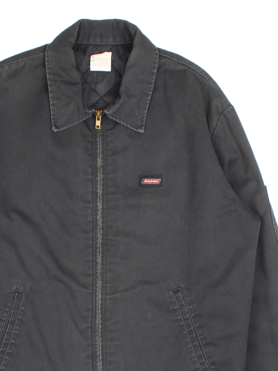 Vintage Dickies Eisenhower Jacket in a blue colourway. Zips up and has side pockets, insulated with a quilted lining, and has the logo embroidered on the front.