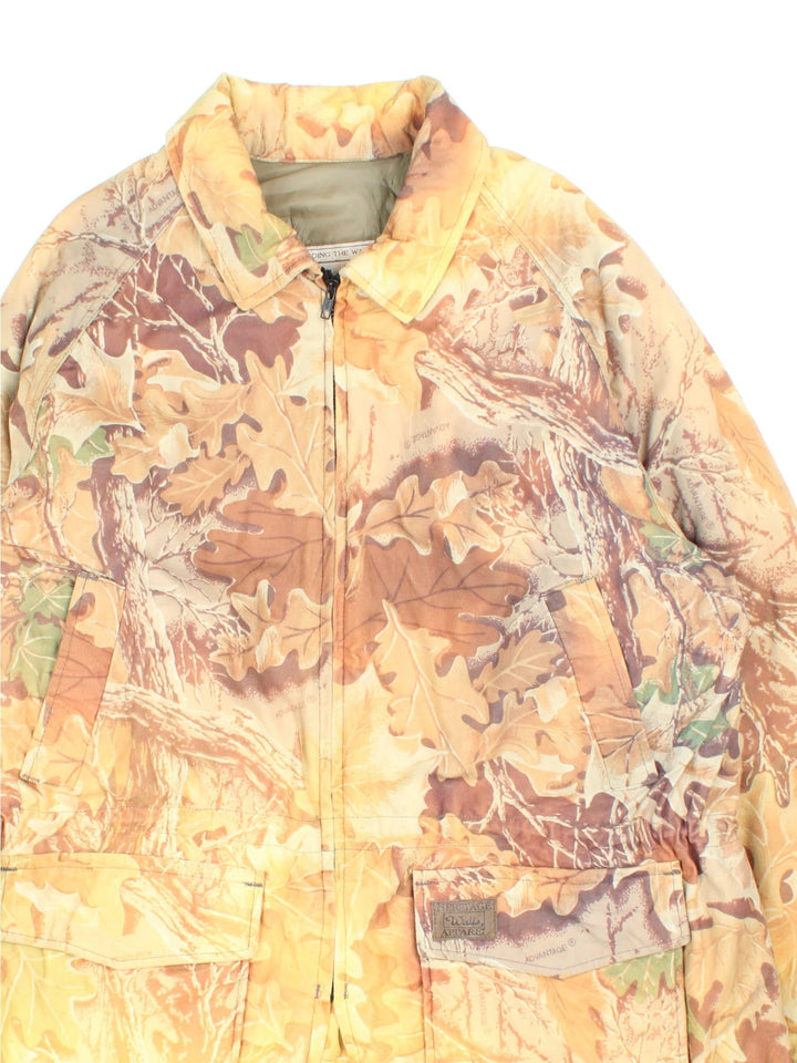 Vintage Walls Forest Camo Outdoors Jacket in a orange, brown and yellow patterned colourway. Zips up and has multiple pockets, insulated with a quilted lining, and has the logo embroidered on the front.