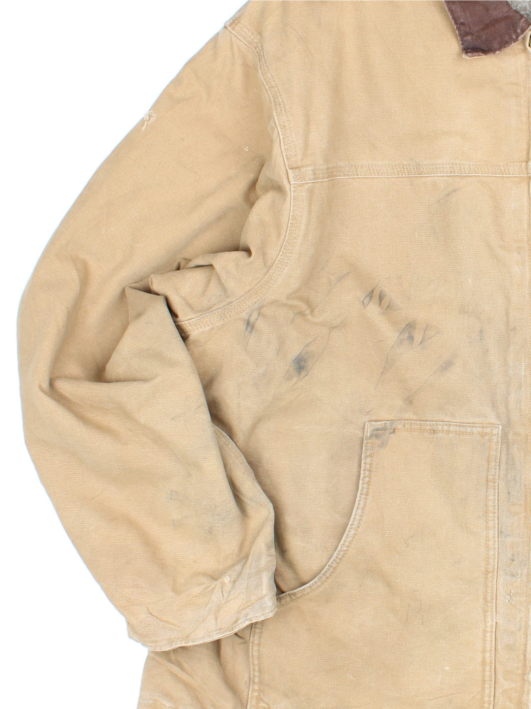 Vintage Carhartt Arctic Jacket in a tan colourway. Zips up and has multiple pockets, insulated with a sherpa lining, has the logo embroidered on the front, and 'Flora Trucking Inc' company logo / spell out embroidered on the back.