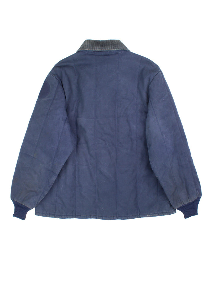 Vintage Walls Blizzard-Pruf Jacket in a navy blue colourway. Zips up and has side pockets, insulated with a quilted lining, and has a corduroy collar.