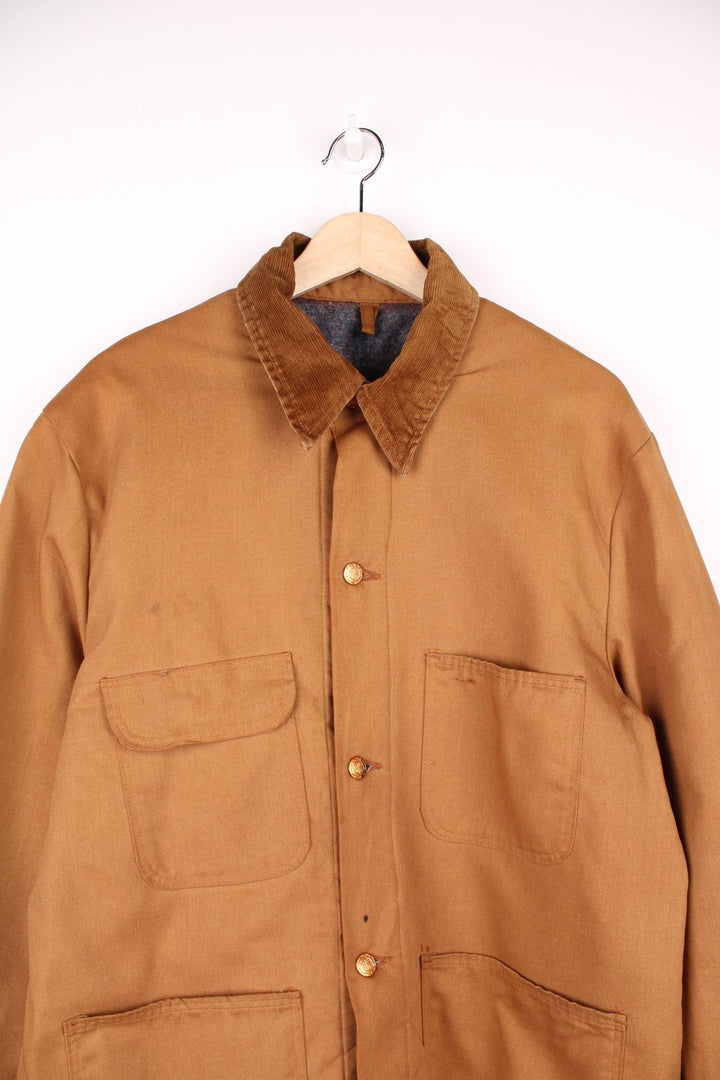 Wrangler Big Ben Jacket in a brown colourway with a corduroy collar, button up with multiple chore style pockets and has a blanket lining. 