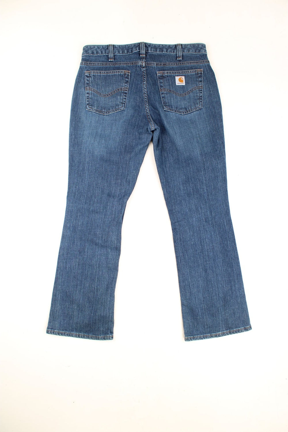 Carhartt Jeans in a blue denim colourway, curvy fit, pockets, and has the logo embroidered on the back. 