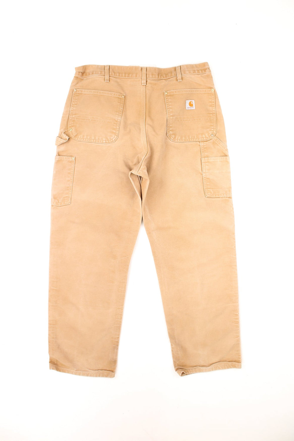 Vintage Carhartt Double Knee Trousers in a tan colourway, multiple pockets and has the logo embroidered on the back.