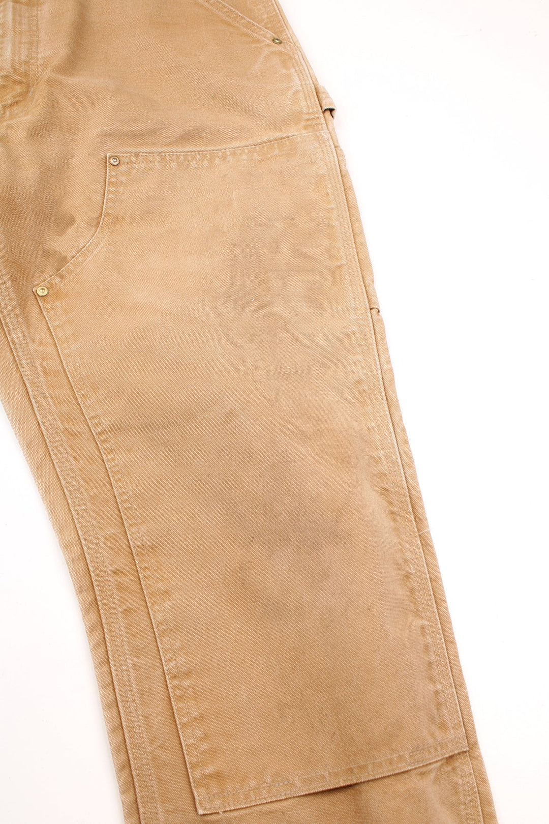 Vintage Carhartt Double Knee Trousers in a tan colourway, multiple pockets and has the logo embroidered on the back.