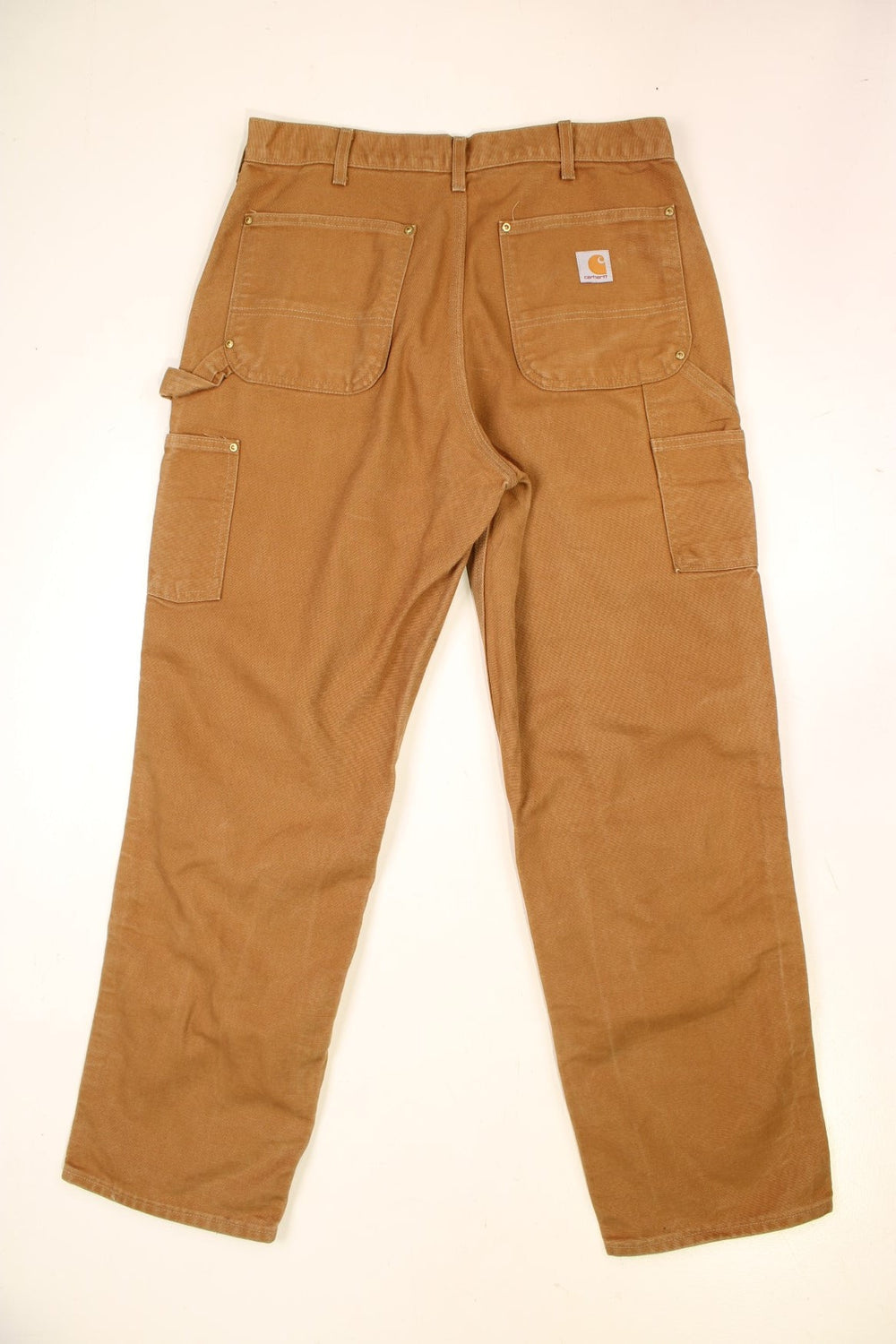 Carhartt Double Knee Jeans in a brown colourway with multiple pockets and the logo embroidered on the back.