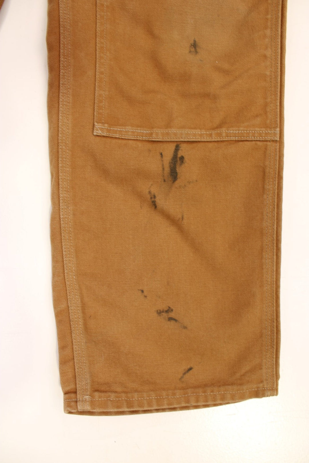 Carhartt Double Knee Jeans in a brown colourway with multiple pockets and the logo embroidered on the back.