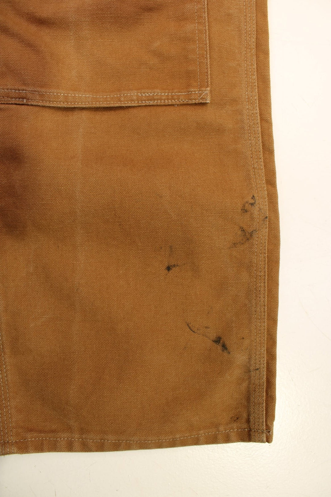 Carhartt Double Knee Jeans in a brown colourway with multiple pockets and the logo embroidered on the back.