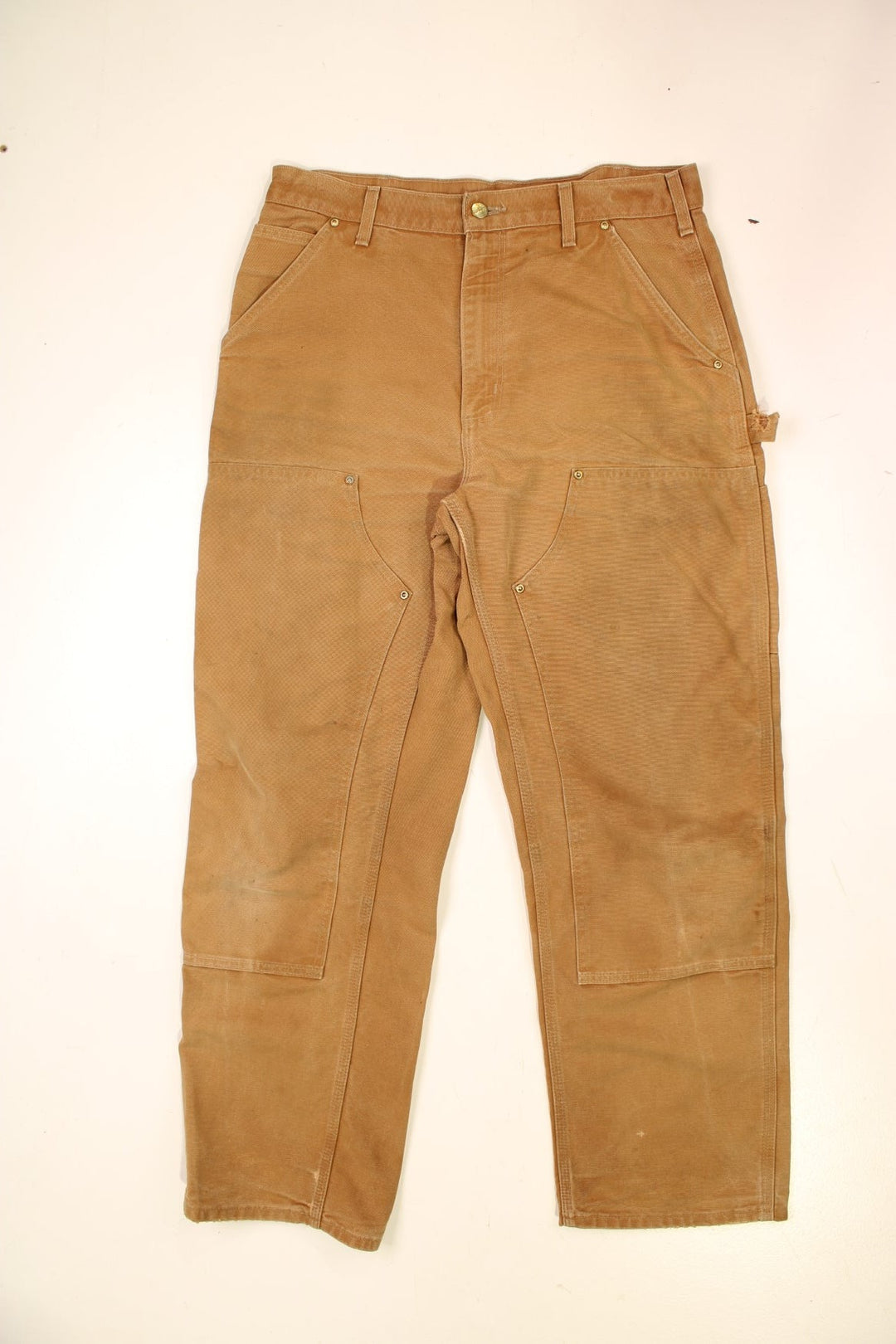 Carhartt Double Knee Jeans in a brown colourway with multiple pockets and the logo embroidered on the back.