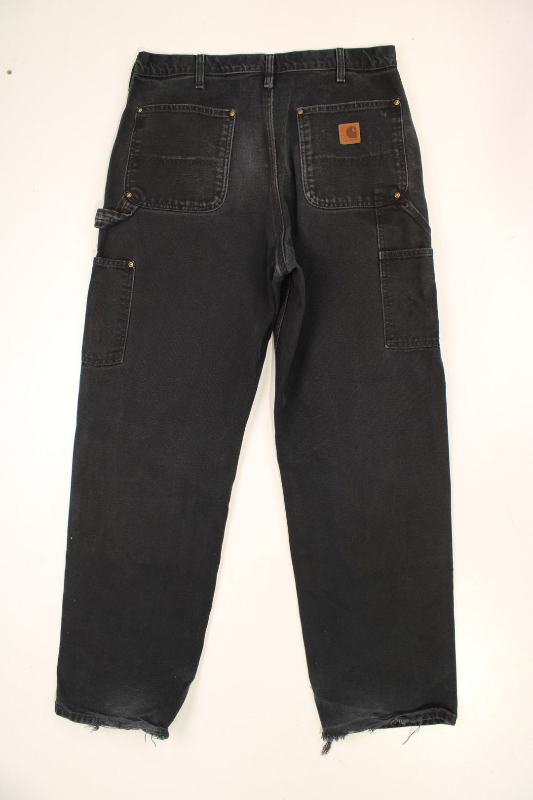 Carhartt Double Knee Jeans in a black colourway with multiple pockets and the logo embroidered on the back.