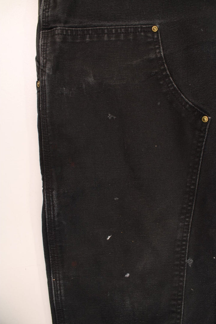 Carhartt Double Knee Jeans in a black colourway with multiple pockets and the logo embroidered on the back.