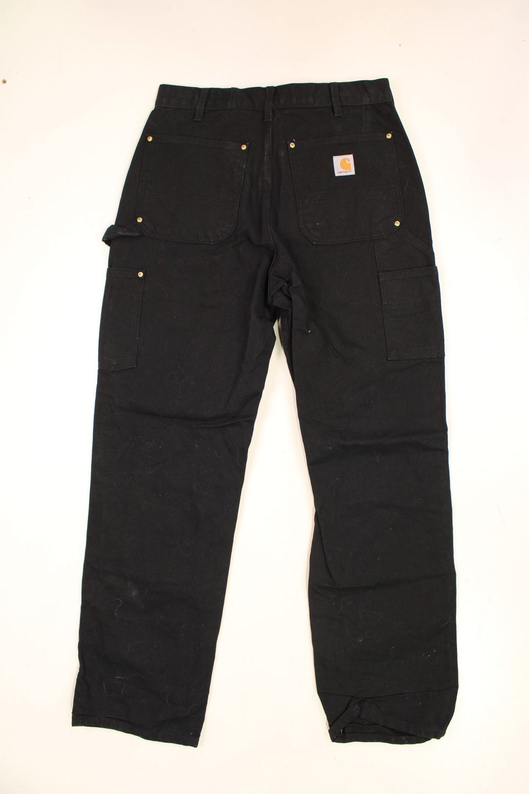 Carhartt Double Knee Jeans in a black colourway with multiple pockets and the logo embroidered on the back.