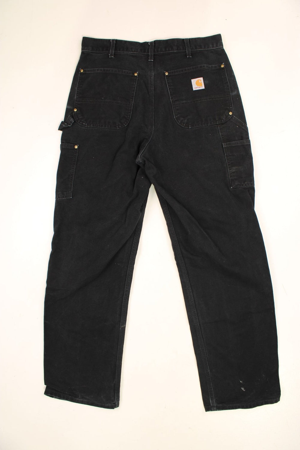 Carhartt Double Knee Jeans in a black colourway with multiple pockets and the logo embroidered on the back.